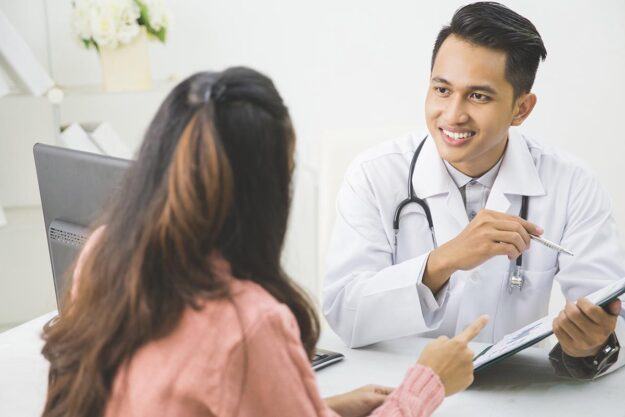 A client meets with a physician to discuss alcohol and genetic predispositions