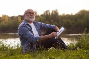 Older man outside enjoying his recovery from alcohol abuse