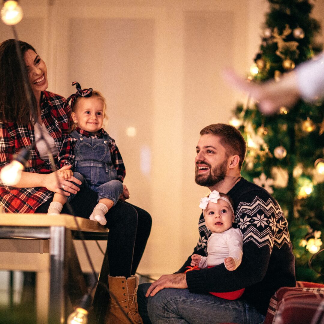a family looking happy in holiday attire symbolizing sobriety